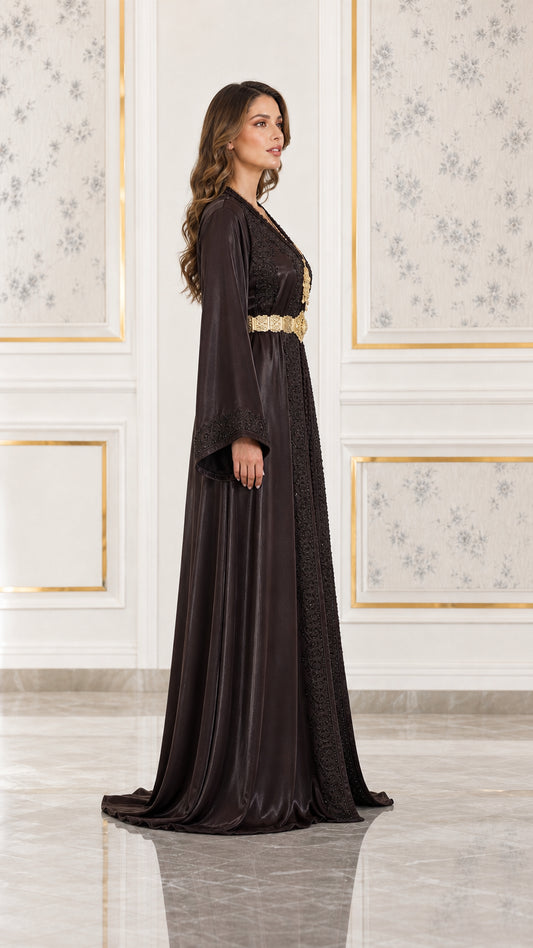 Side profile view of woman wearing chocolate brown embroidered satin kaftan gown