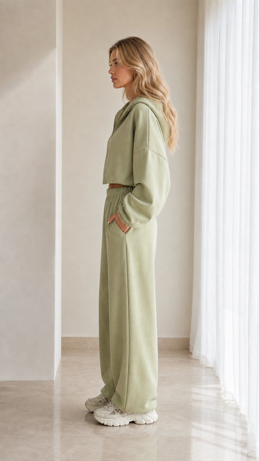 Side profile of model in sage green matching tracksuit set