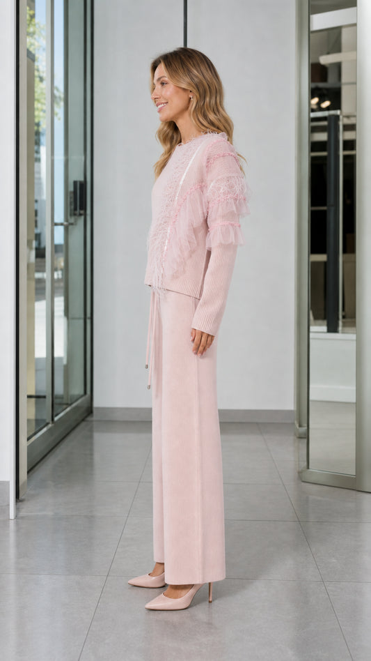 Side view of woman in Light Pink two-piece knit sweater and wide-leg trouser set