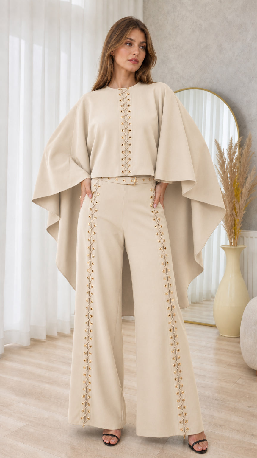 Front full-length view of beige cream cape top and lace-up wide-leg trouser set