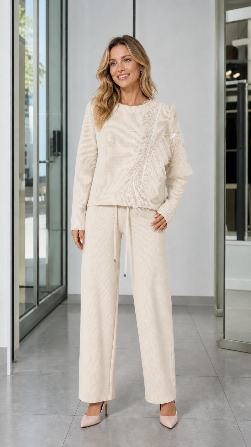 Full-length front view of woman wearing Cream knit sweater and wide-leg pants set