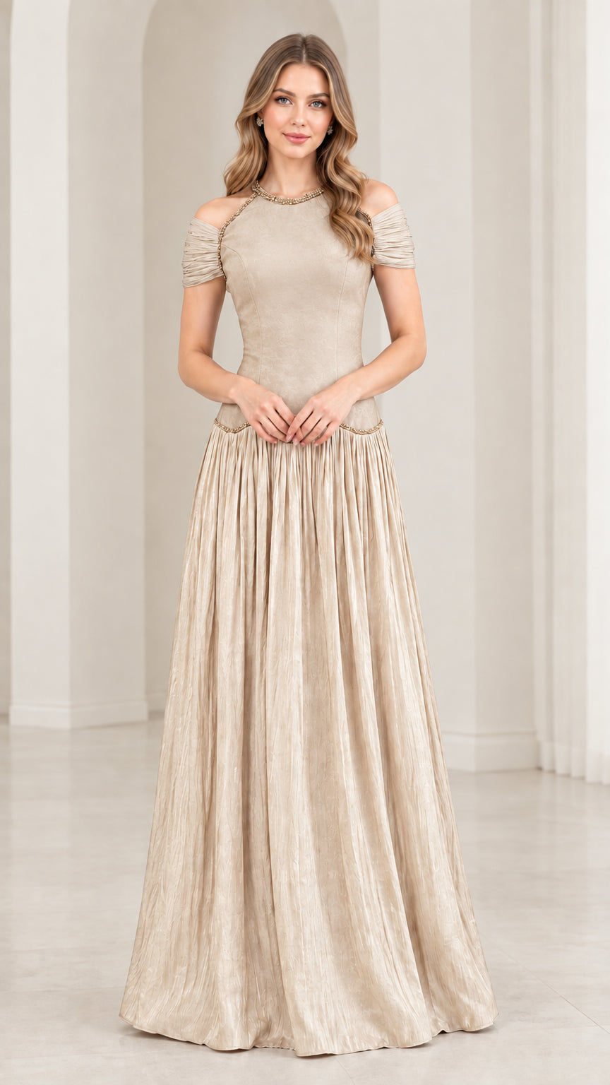 Woman wearing champagne beige cold shoulder beaded pleated maxi dress