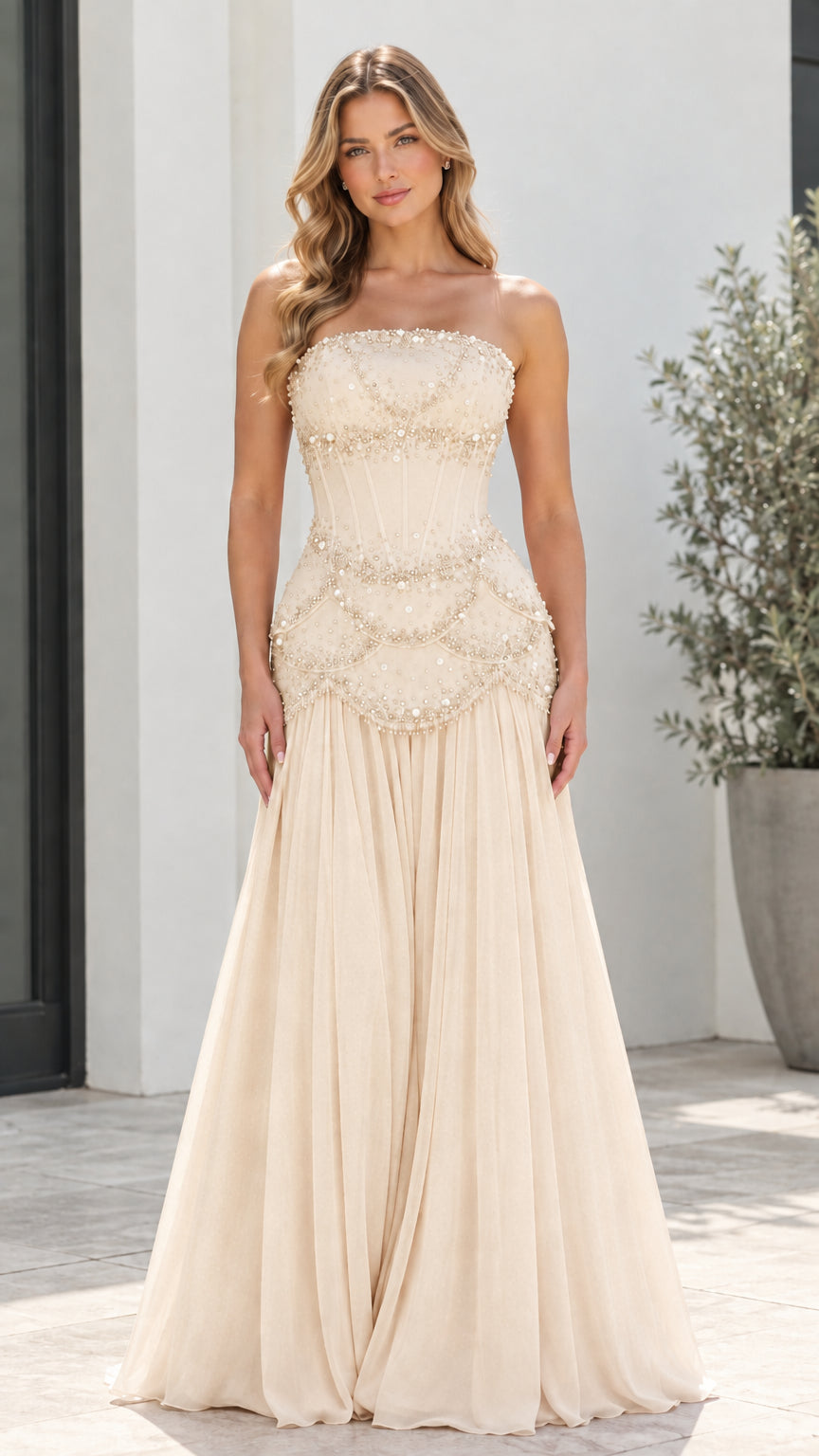 Model wearing Champagne strapless beaded corset pleated evening gown