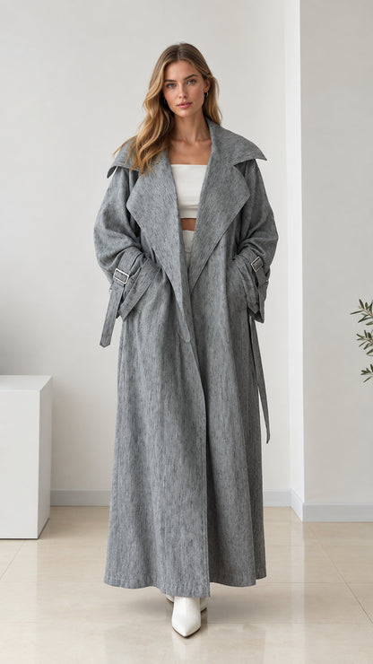 Full front view of women's oversized grey maxi trench coat with tie belt
