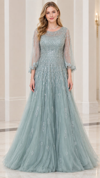 Front view of woman wearing dusty blue beaded tulle A-line evening gown with 3/4 illusion sleeves