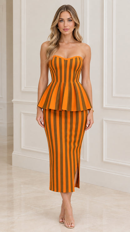 Front full-length view of model wearing the orange striped strapless peplum midi dress