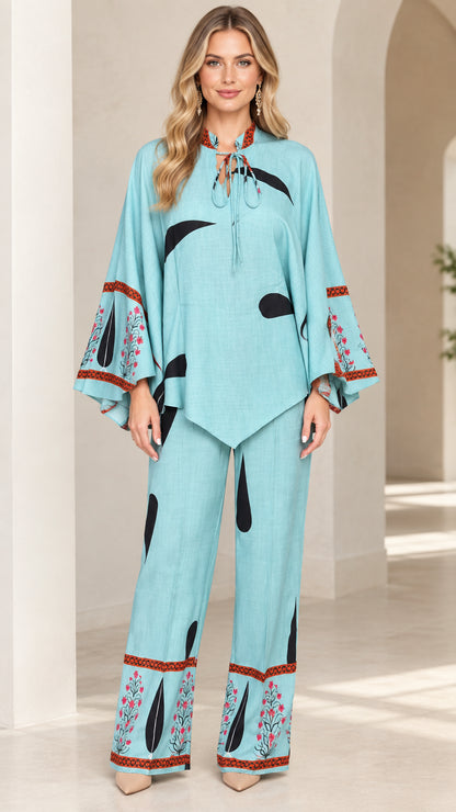 Front full view of women's sky blue printed tie-neck tunic and wide-leg pants set