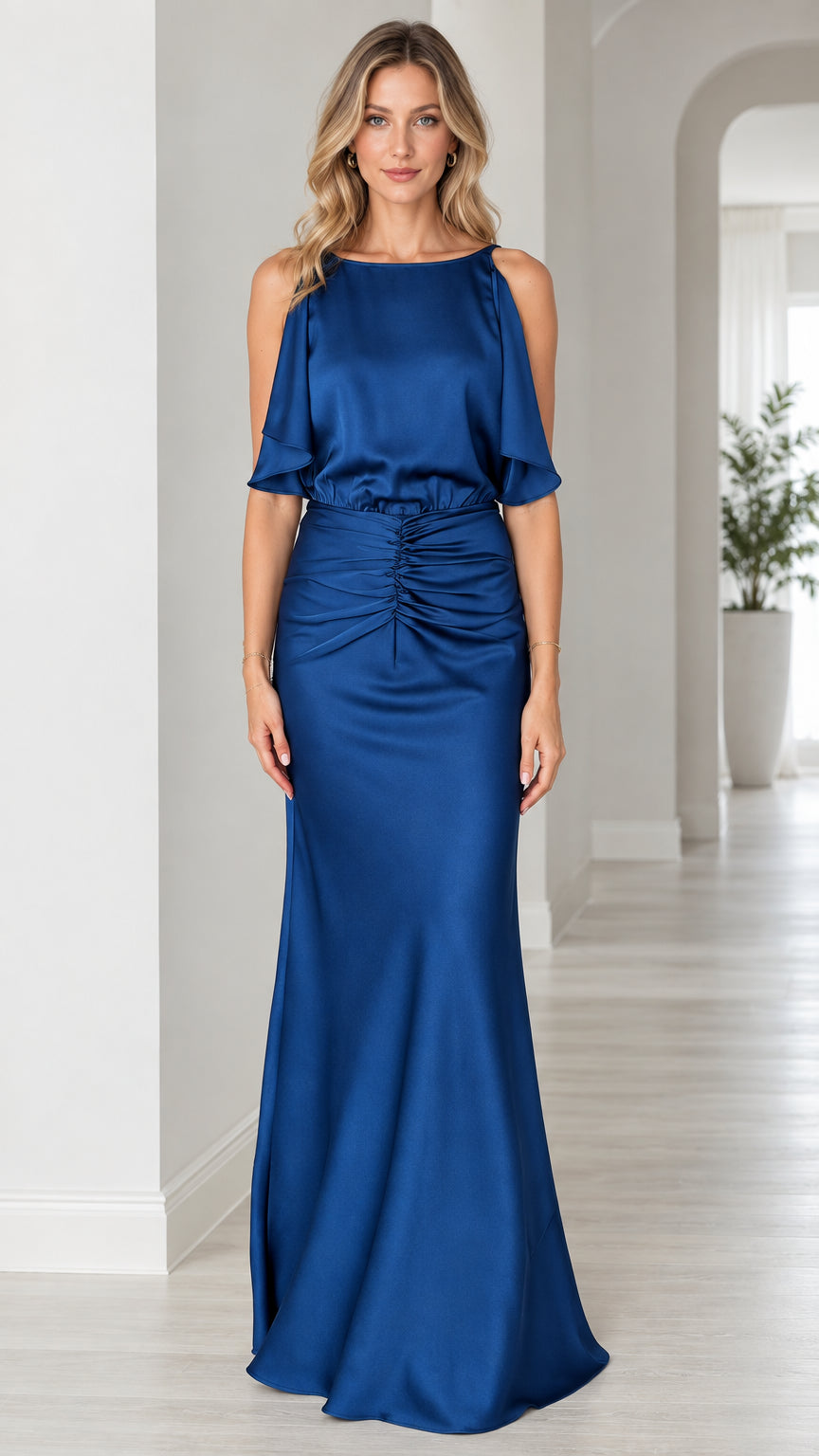 Front full view of woman wearing royal blue satin evening gown with flutter overlay