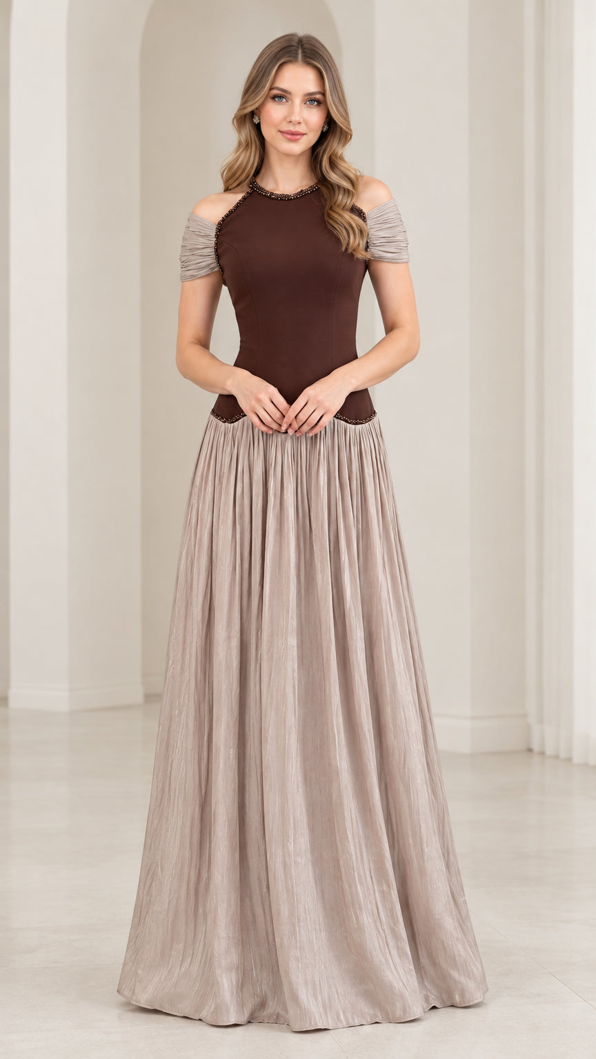 Front view of woman wearing chocolate brown and taupe cold shoulder beaded pleated maxi dress