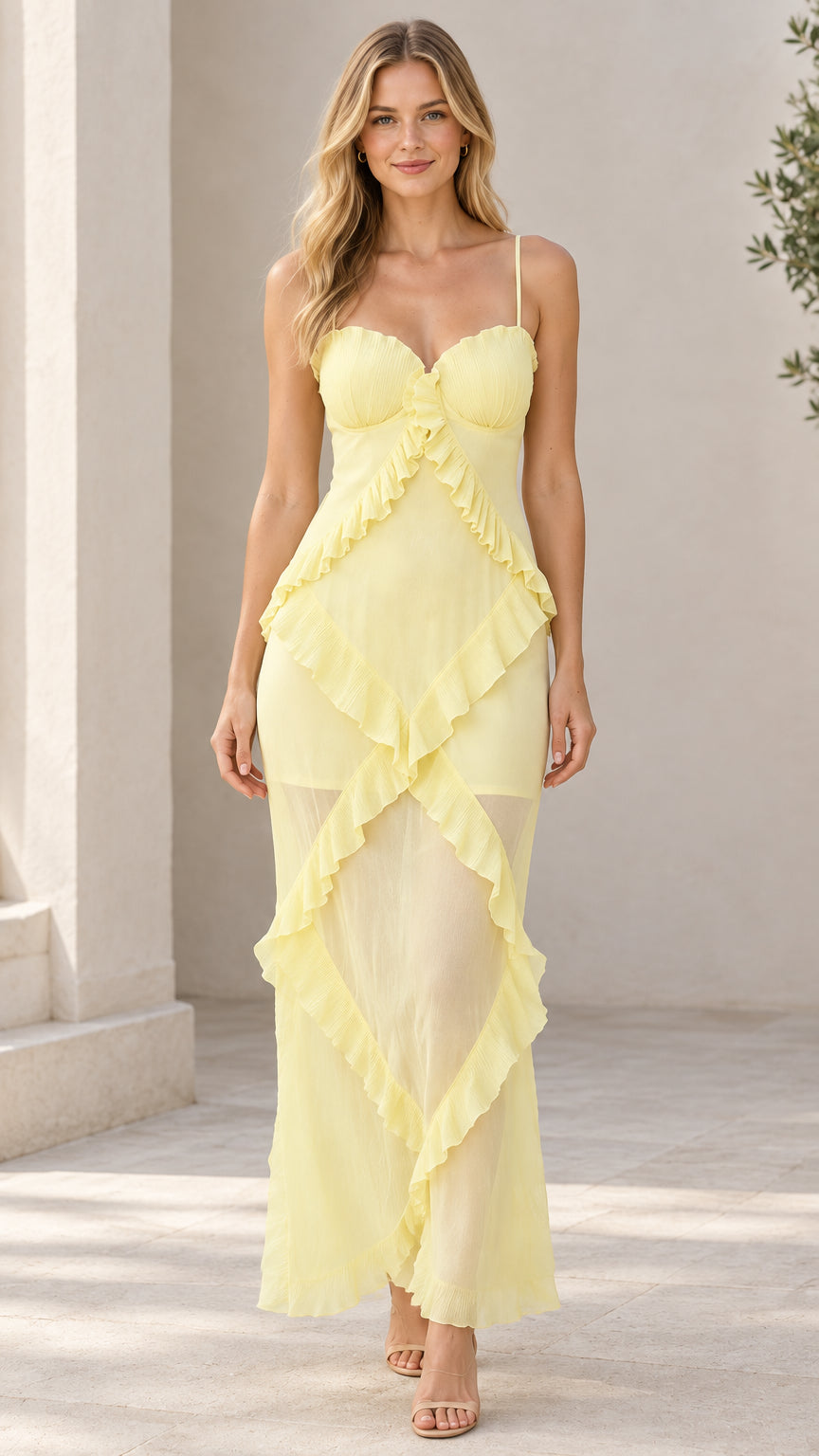 Front view of model wearing pastel yellow sweetheart cascading ruffle cami maxi dress