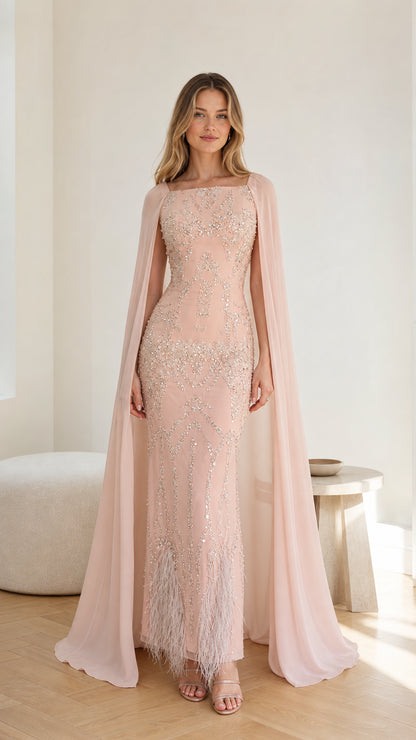 Full front view of the Blush Pink sequin cape evening gown with feather hem