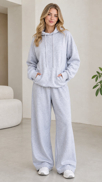 Front view of model wearing light grey 2-piece hoodie and wide leg lounge pants set