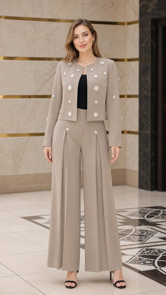 Front view of model wearing taupe embellished cropped jacket and wide-leg pant suit set