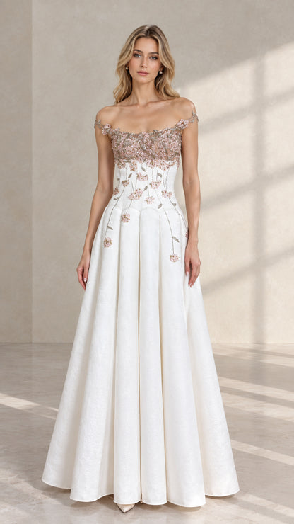 Front view of model wearing white off-the-shoulder A-line evening gown with pink 3D floral appliques