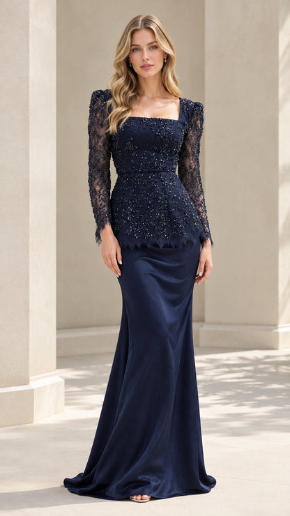 Front full view of woman wearing Navy Blue beaded lace peplum evening gown with long sleeves