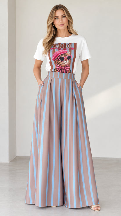 Front view of woman wearing white graphic tee and mocha blue striped wide-leg pants set