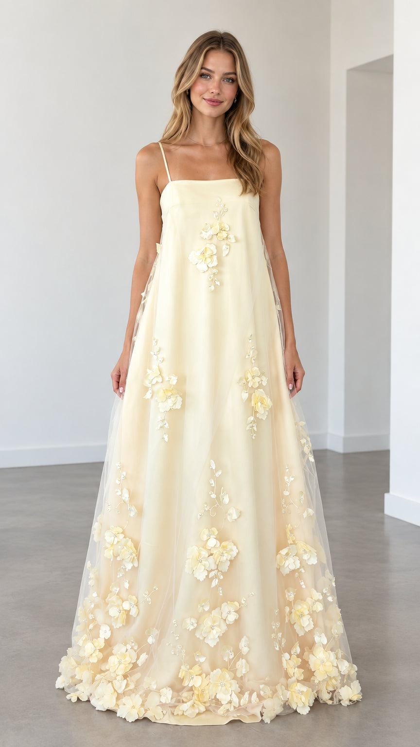 Model wearing butter yellow 3D floral applique spaghetti strap maxi dress front view