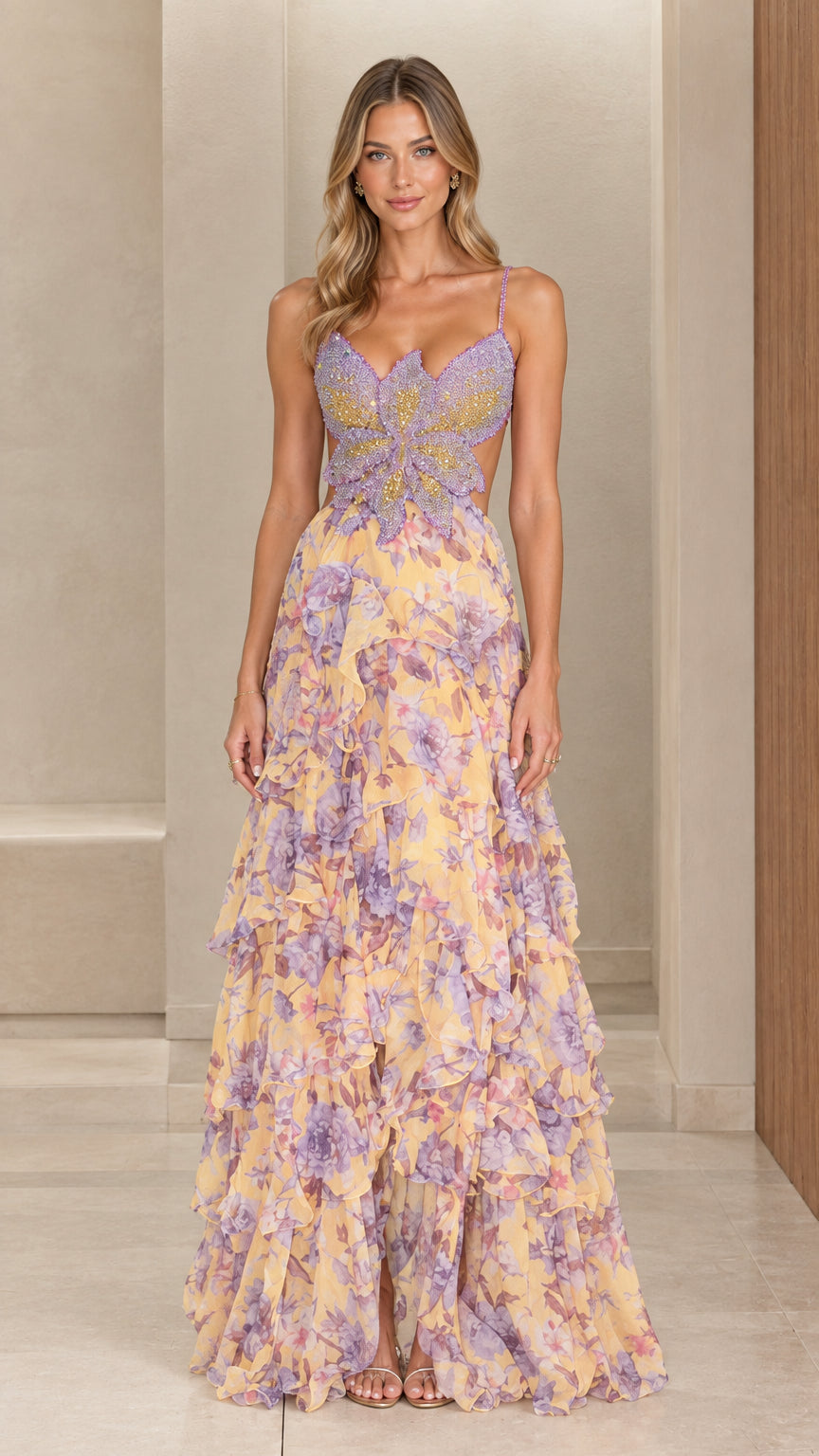Front view of woman wearing pastel yellow floral chiffon maxi dress with beaded butterfly bodice