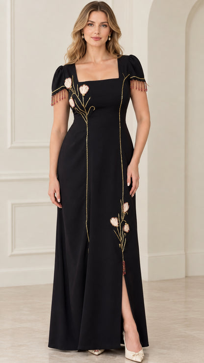 Front view of black square neck maxi dress with floral embroidery and beaded sleeve fringe