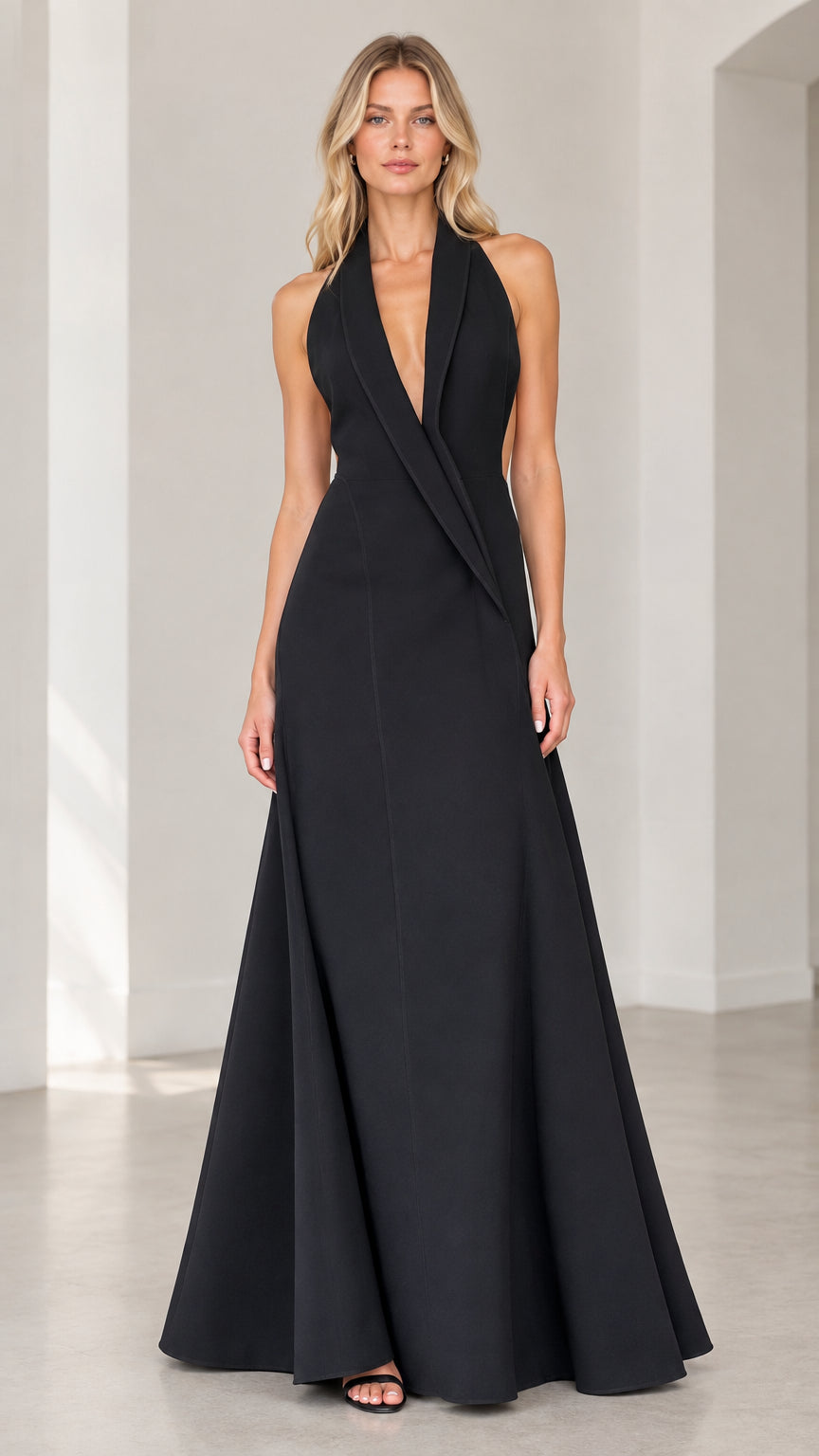 Front view of black halter tuxedo lapel backless evening gown on model