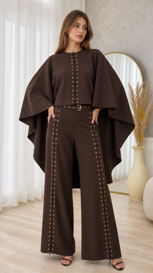 Front full-length view of model wearing chocolate brown cape top and eyelet wide-leg pant set
