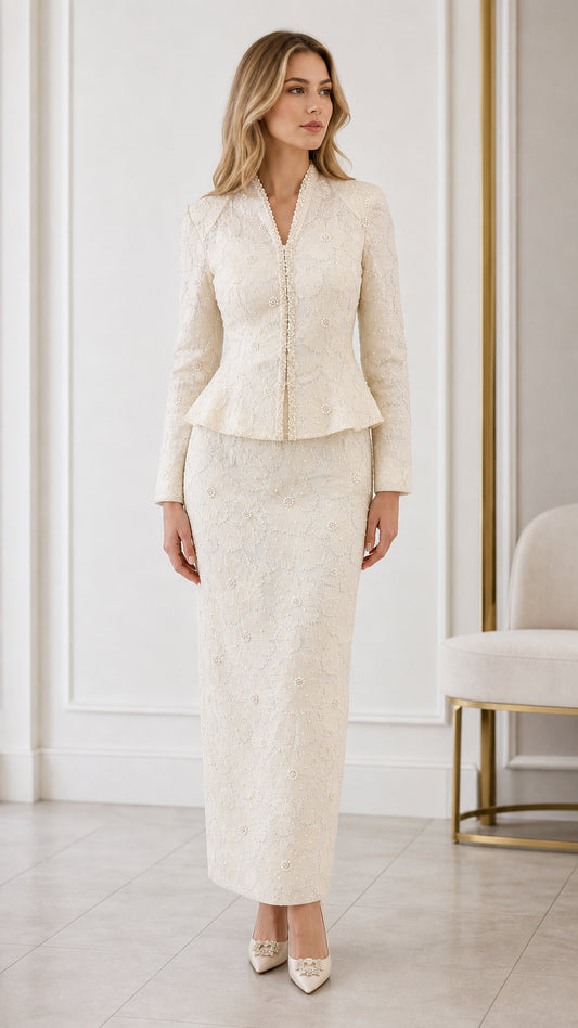 Full front view of cream embroidered peplum jacket and maxi skirt suit