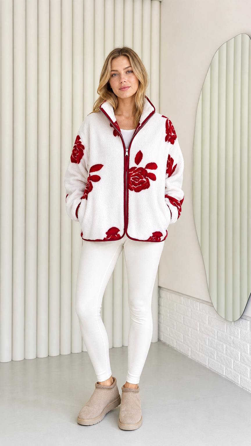 Model wearing white fleece jacket with red floral pattern and contrast trim front view
