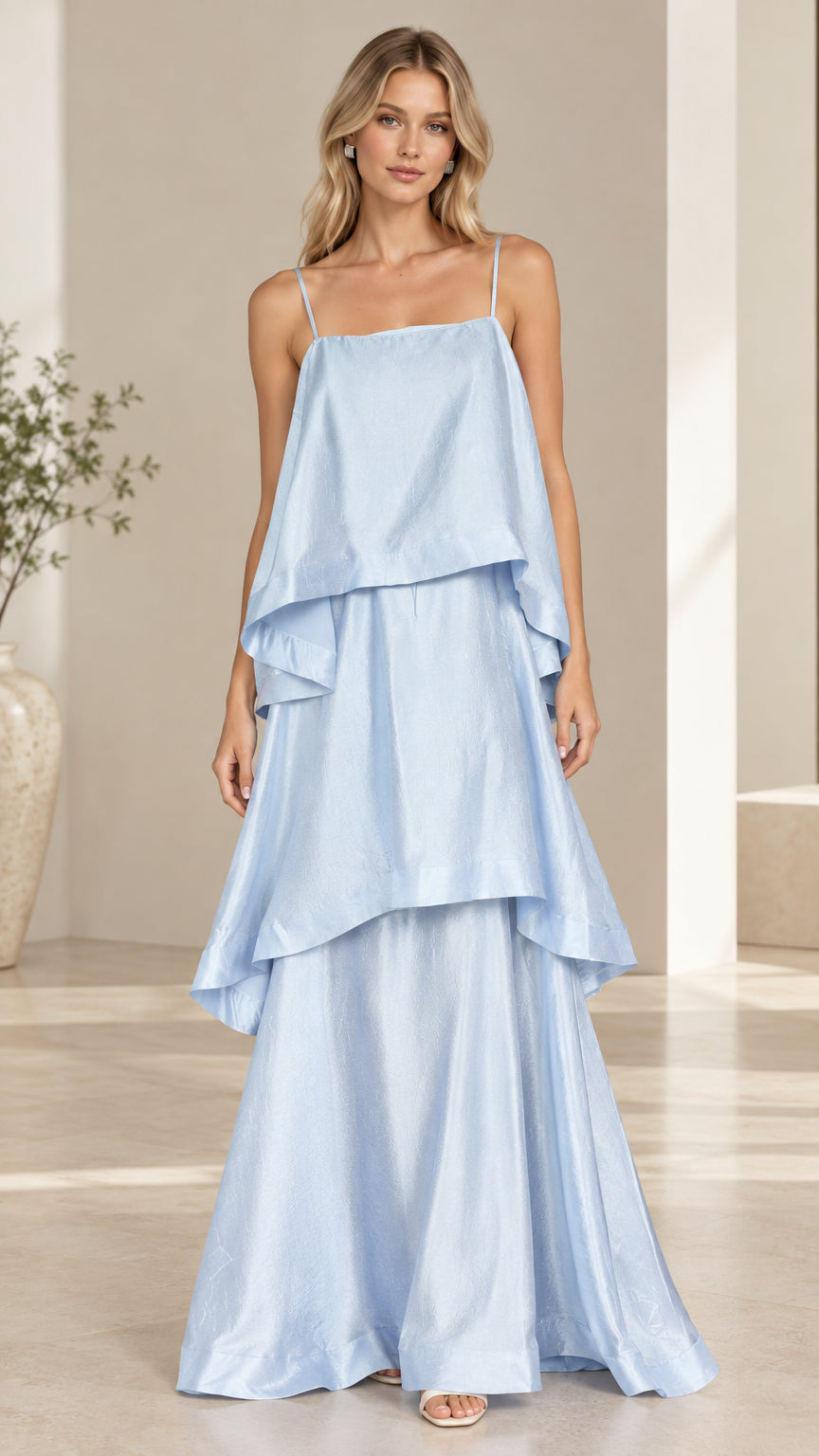 Model wearing light blue tiered cami maxi dress front view