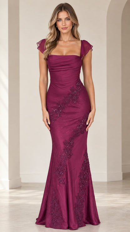 Full-length front view of woman wearing magenta flutter sleeve mermaid evening gown with embroidered beading