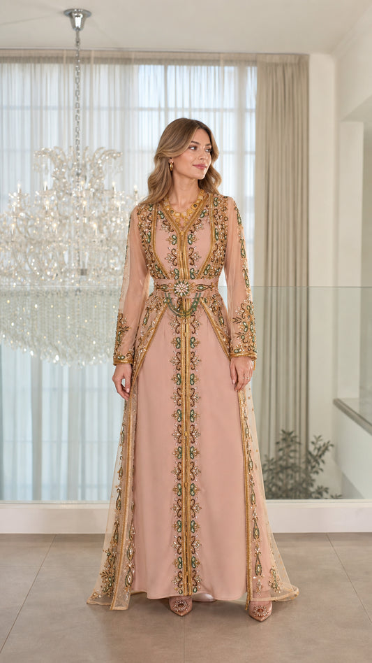 Front full-length view of model wearing dusty pink embroidered Moroccan kaftan evening dress with embellished belt