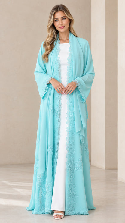 Front view of model wearing an aqua blue floor-length chiffon duster with delicate lace trim over a white dress