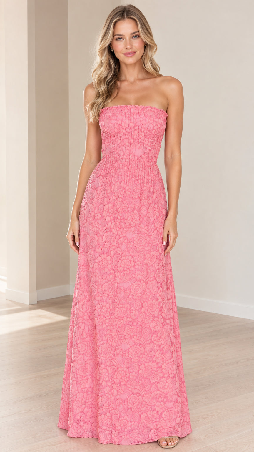 Front view of model wearing pink strapless floral textured maxi dress
