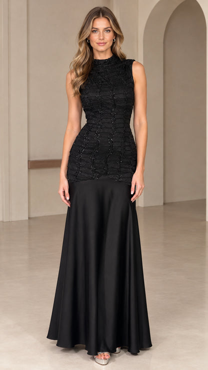 Front view of black high neck sleeveless drop-waist beaded maxi evening gown