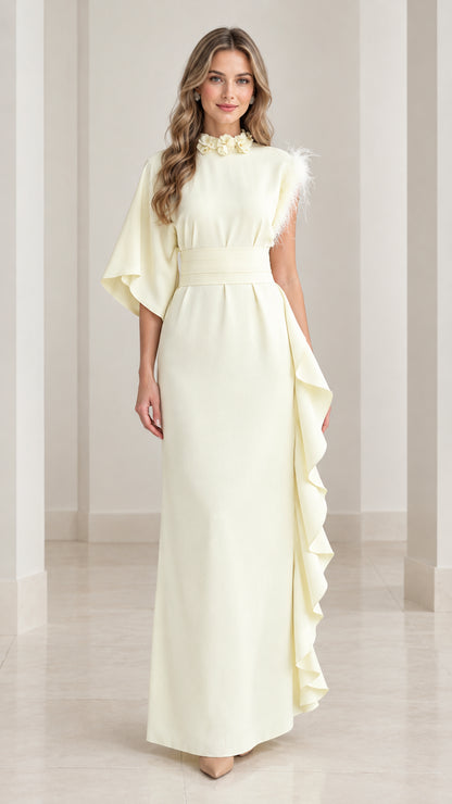 Full front view of butter yellow asymmetrical one-sleeve maxi dress with floral collar and side ruffle
