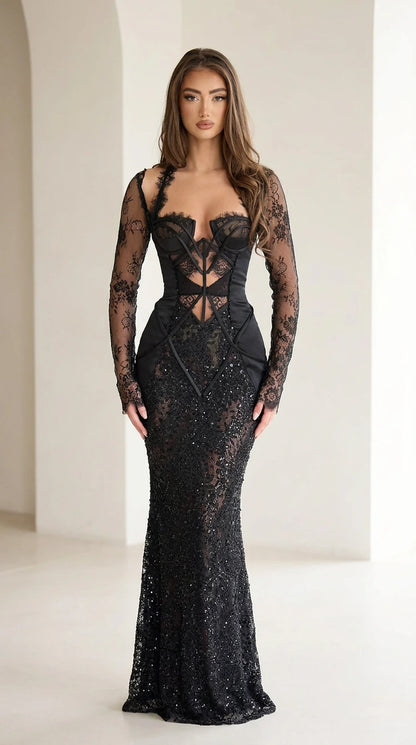Full front view of black corset boned lace sequin evening gown with sheer long sleeves