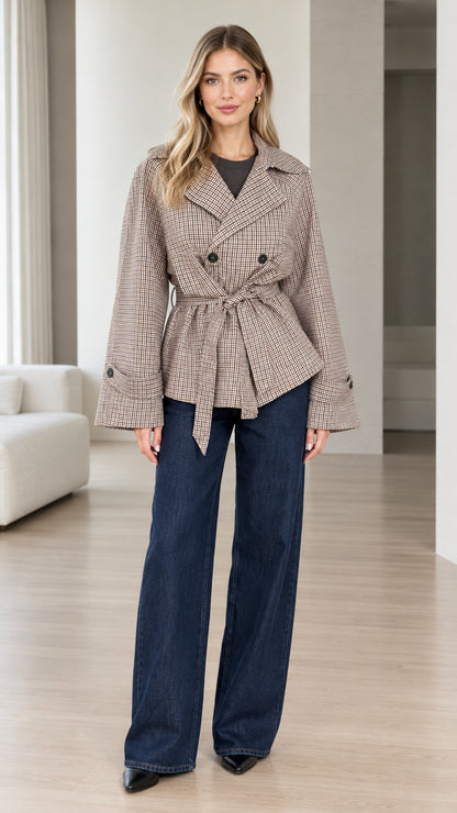 Front full-length view of model wearing brown plaid belted short jacket with wide-leg jeans