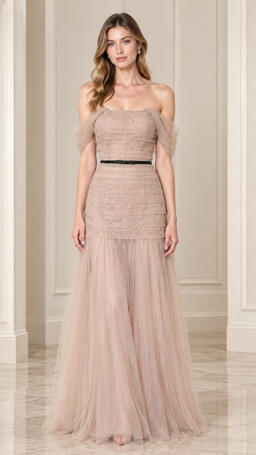 Front full-length view of champagne off-the-shoulder beaded tulle evening gown with black waist ribbon