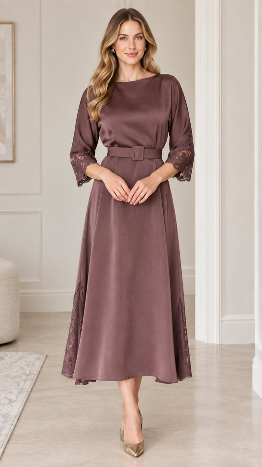Front view of woman wearing elegant mauve A-line midi dress with belt and lace cuffs