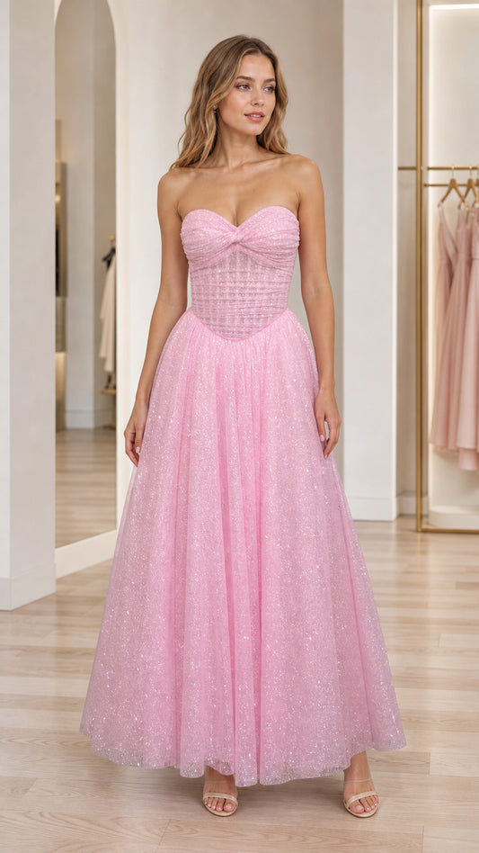 Front view of model wearing pink strapless glitter tulle sweetheart corset evening gown