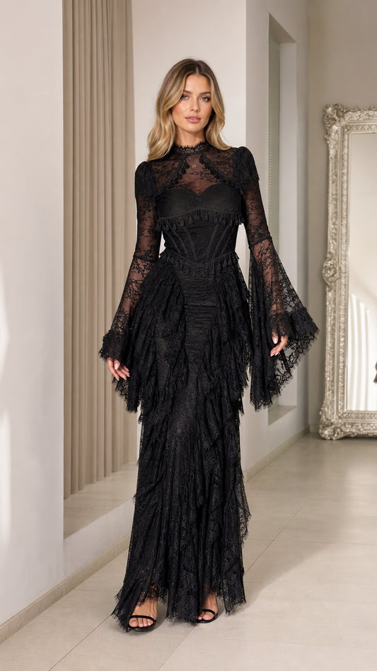 Front view of black lace corset maxi dress with dramatic flared bell sleeves