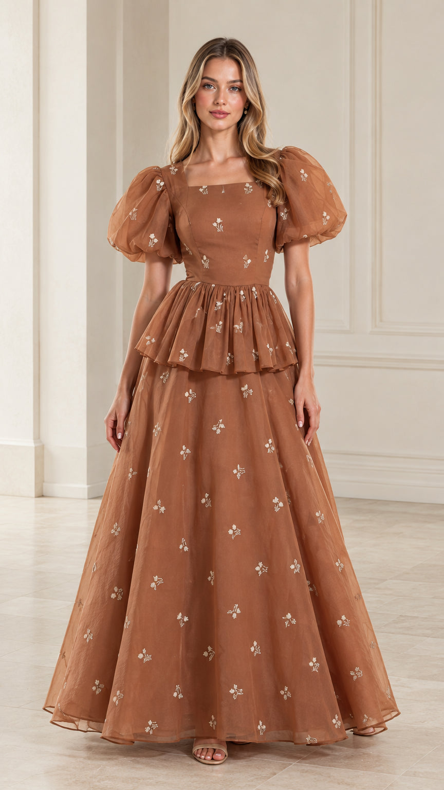 Front full view of woman wearing toffee brown floral embroidered puff sleeve peplum maxi gown
