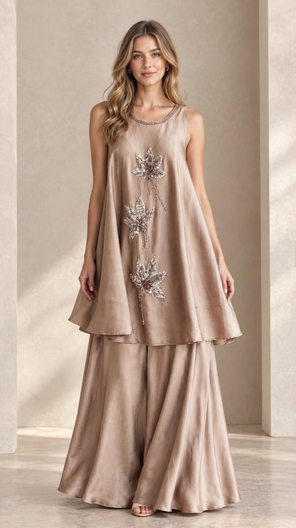 Front view of champagne sleeveless beaded tunic and palazzo pant set