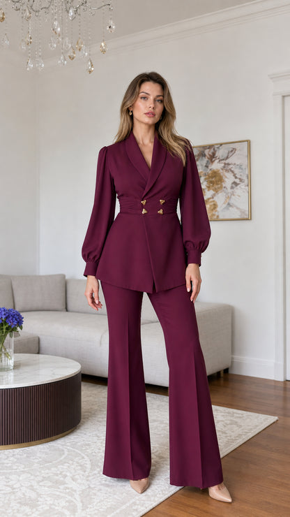 Front full view of burgundy tailored cinched waist blazer and flared pants suit set