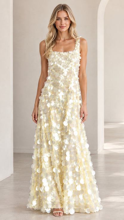 Front view of model wearing ivory square neck paillette sequin maxi evening gown