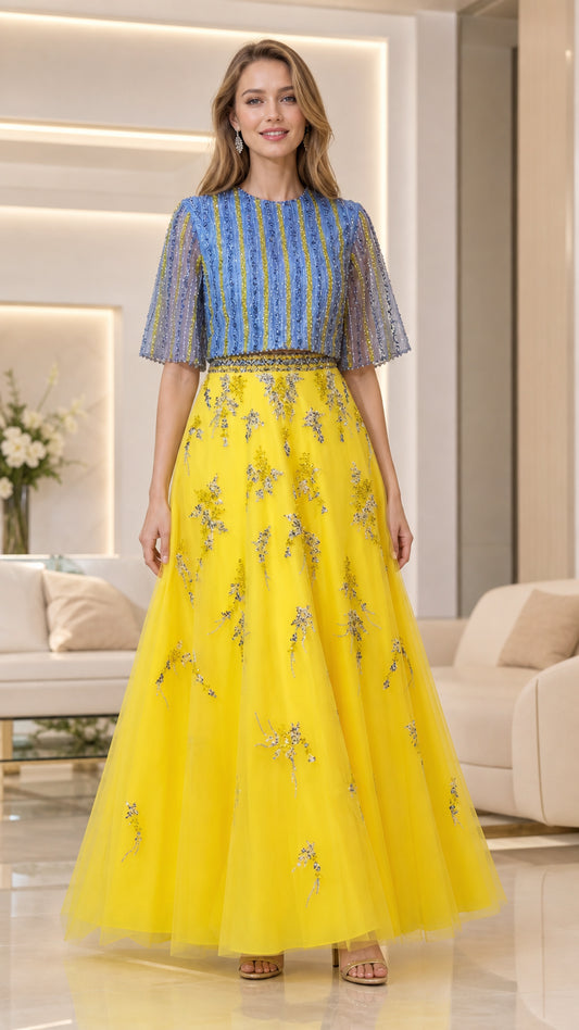 Front view of model wearing yellow and blue beaded tulle A-line evening gown