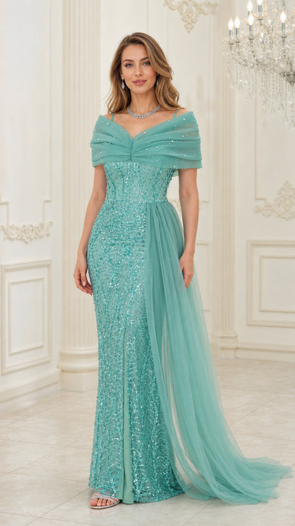 Front view of woman wearing aqua green off-the-shoulder sequin gown with side tulle train
