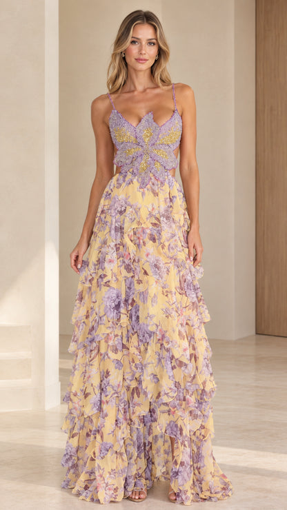 Front view of model wearing yellow floral butterfly beaded bodice tiered maxi dress