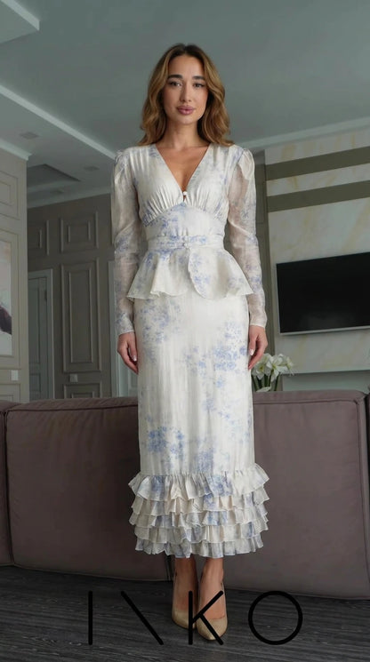 Front view of Ivory Blue floral print long sleeve peplum maxi dress with tiered ruffle hem