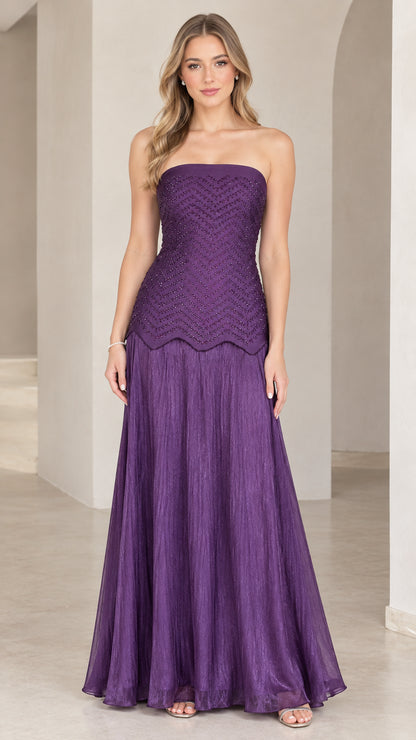 Front view of woman wearing purple strapless beaded drop-waist evening maxi gown