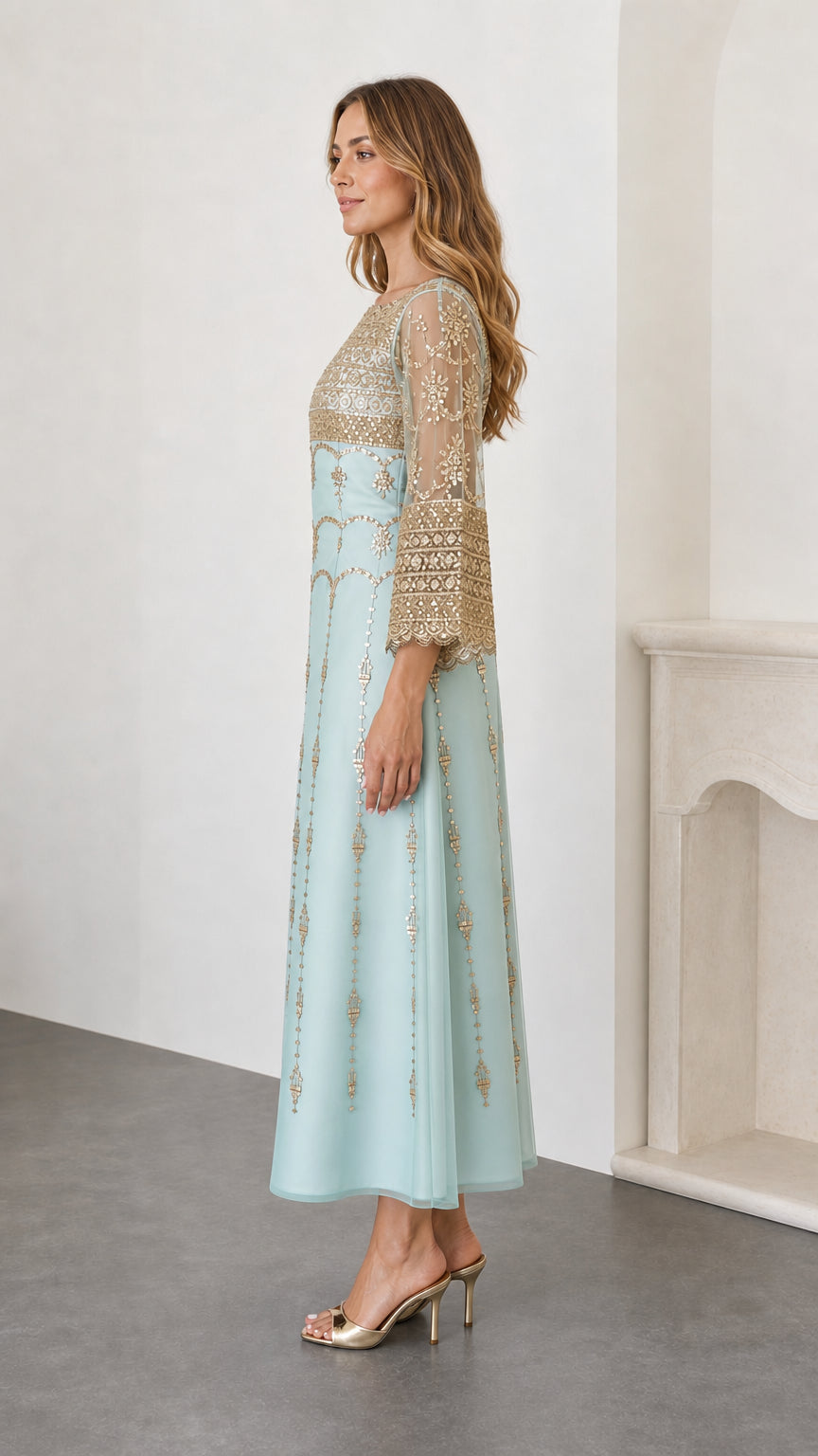 Side profile view of sky blue formal maxi dress with gold embroidery